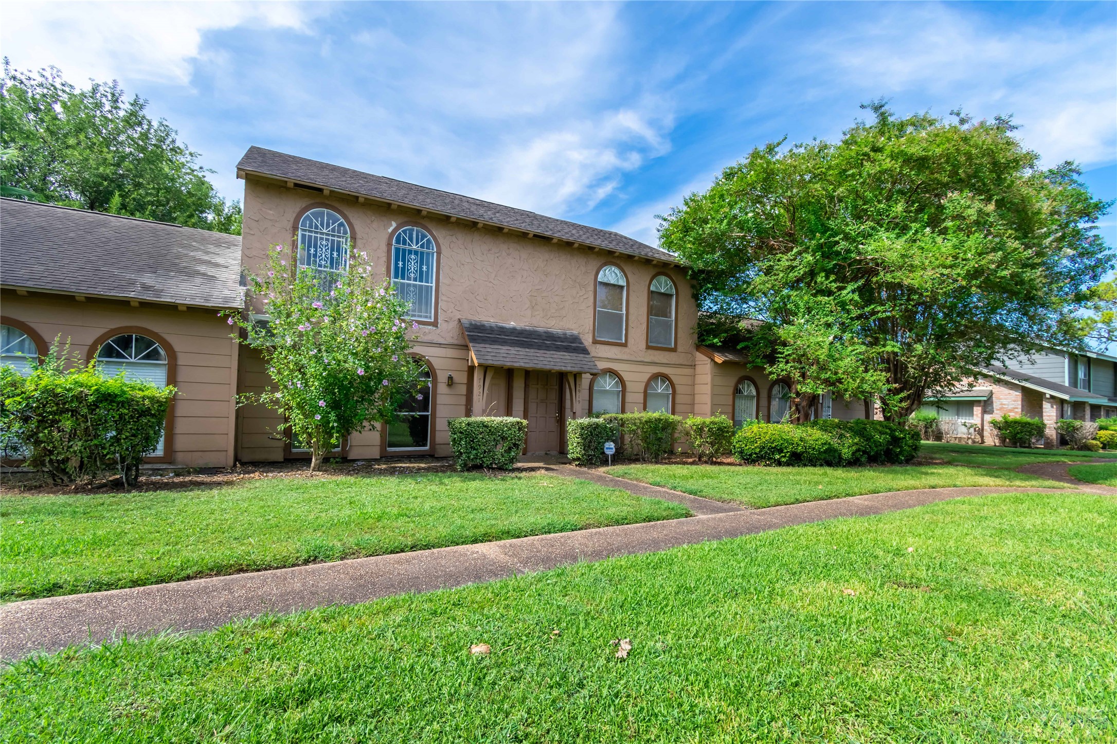 7921 Cook Road Houston, TX 77072 - Photo 15 of 19 a front view of a house with a yard