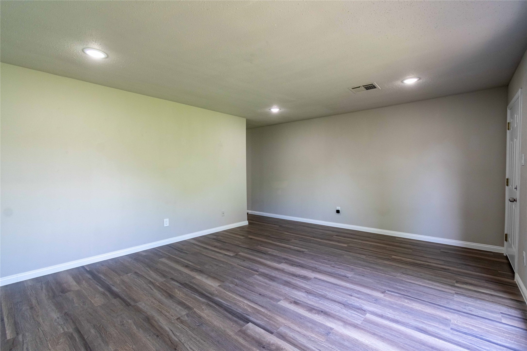 7921 Cook Road Houston, TX 77072 - Photo 8 of 19 a view of room with wooden floor