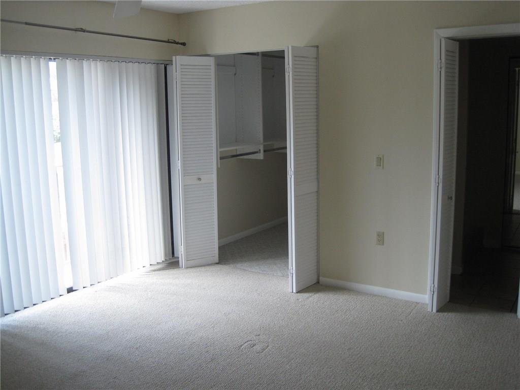 5768 Southeast Windsong Lane Stuart, FL 34997 - Photo 11 of 15 a view of empty room with window