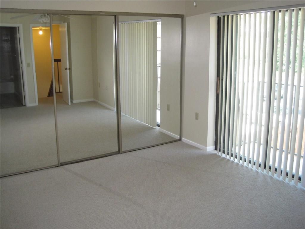 5768 Southeast Windsong Lane Stuart, FL 34997 - Photo 14 of 15 a view of an empty room with a window
