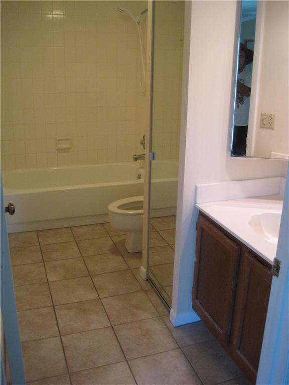 5768 Southeast Windsong Lane Stuart, FL 34997 - Photo 15 of 15 a bathroom with a sink and a mirror