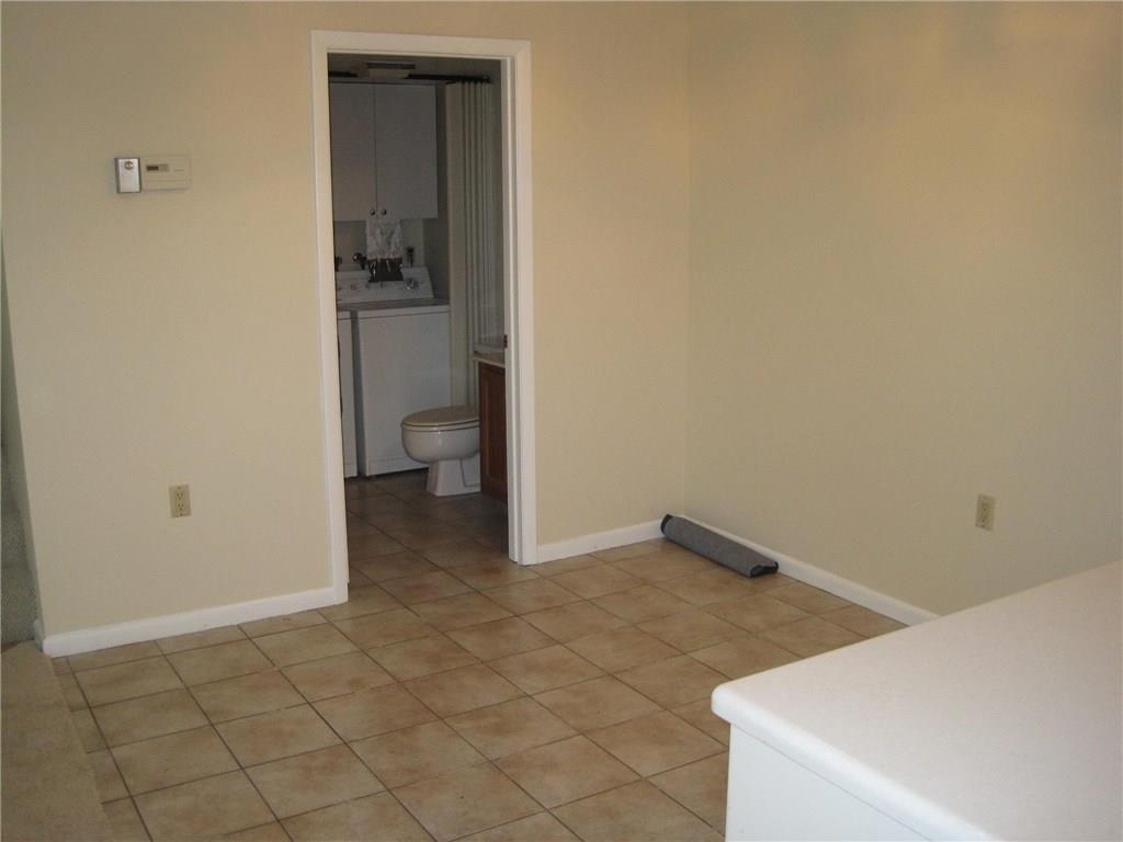 5768 Southeast Windsong Lane Stuart, FL 34997 - Photo 10 of 15 a view of an empty room