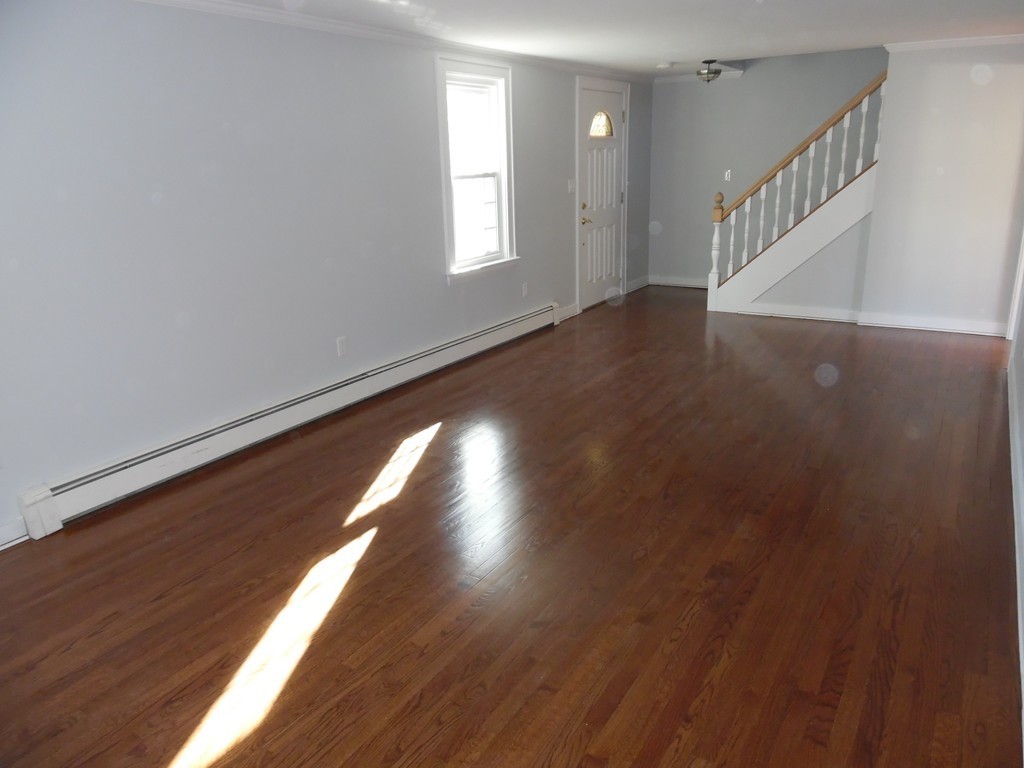 301 Hudson Road Sudbury, MA 01776 - Photo 8 of 23 a view of an entryway with wooden floor