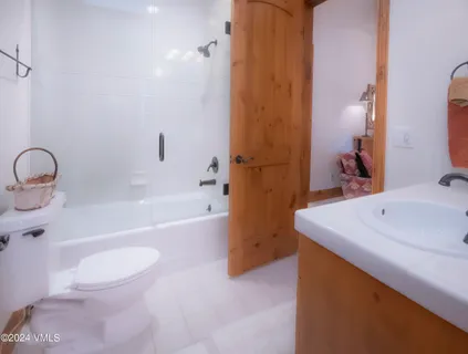 a bathroom with a sink a toilet and a bathtub