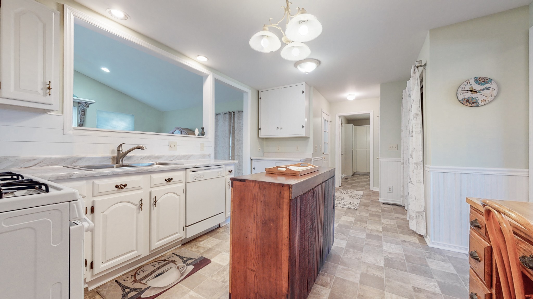 5510 Vanderbilt Road Old Hickory, TN 37138 - Photo 21 of 38 a kitchen with granite countertop a sink a stove refrigerator and cabinets