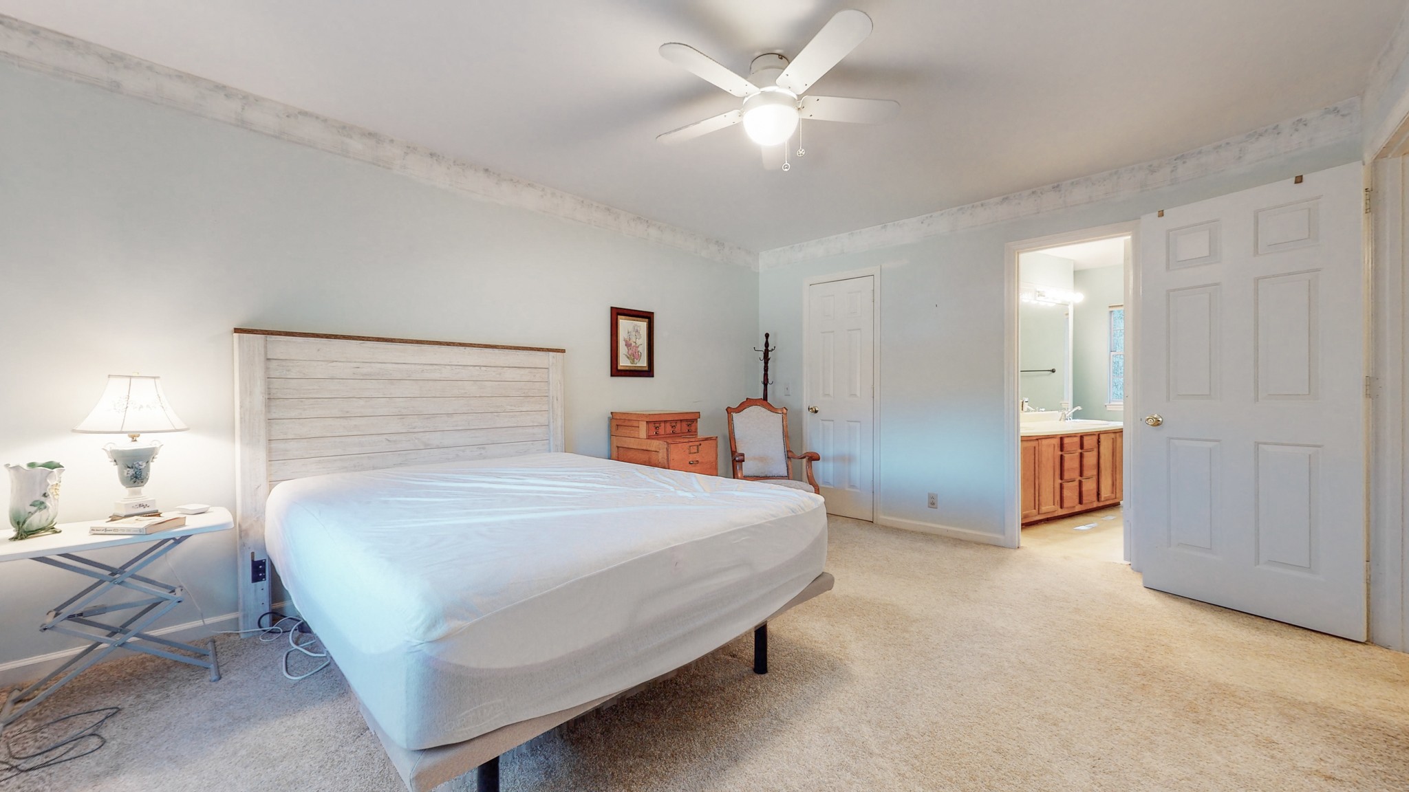 5510 Vanderbilt Road Old Hickory, TN 37138 - Photo 32 of 38 a bedroom with a bed and a chandelier