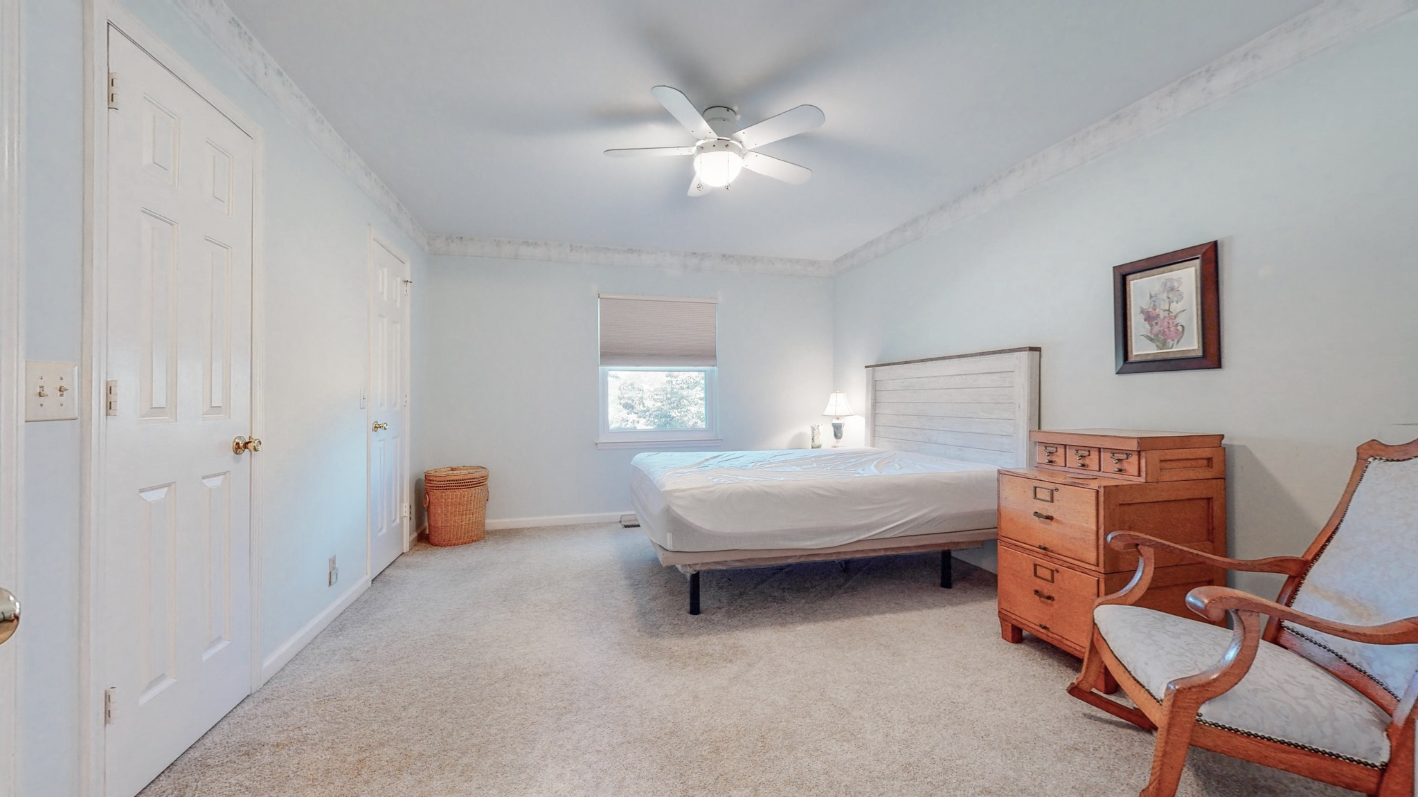 5510 Vanderbilt Road Old Hickory, TN 37138 - Photo 33 of 38 a spacious bedroom with a bed and a chandelier
