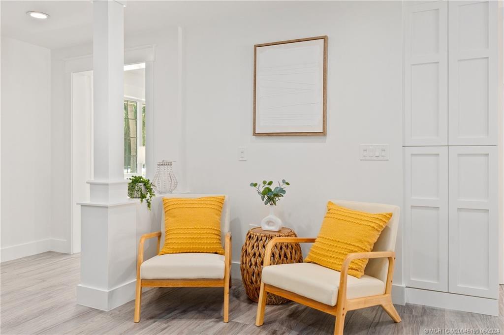 3 Mandalay Road Stuart, FL 34996 - Photo 16 of 65 a living room with a couch and a table