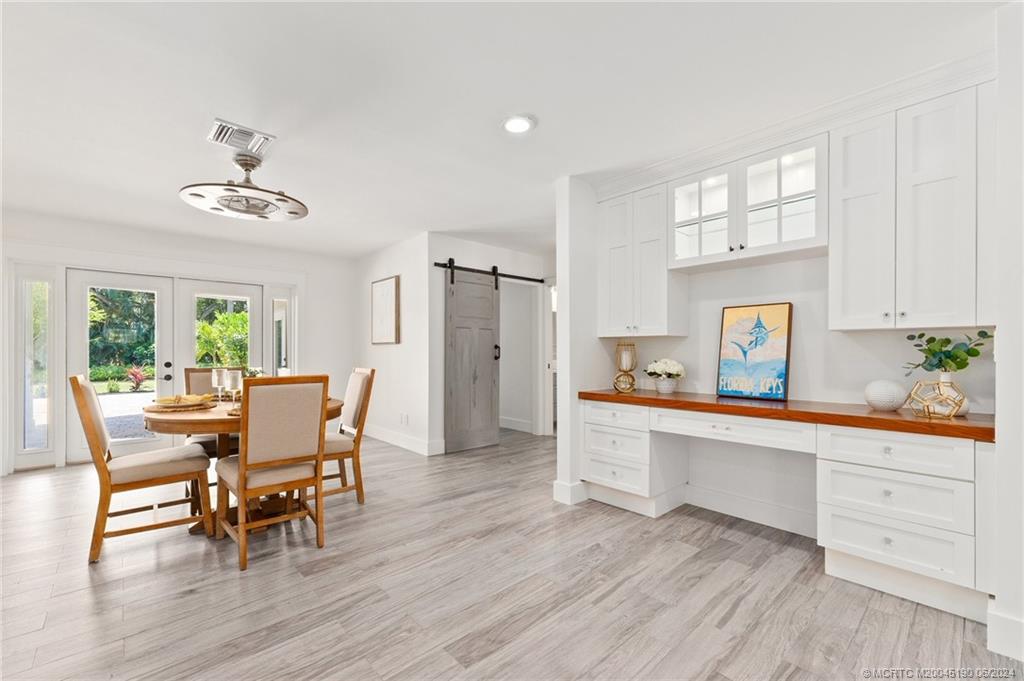 3 Mandalay Road Stuart, FL 34996 - Photo 20 of 65 a view of a dining room with furniture and window