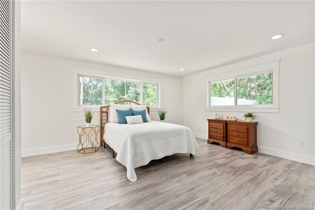 3 Mandalay Road Stuart, FL 34996 - Photo 28 of 65 a room with a bed and a window