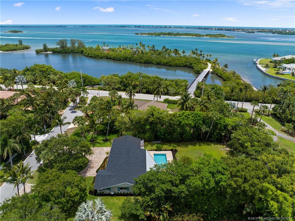3 Mandalay Road Stuart, FL 34996 - Photo 3 of 65 an aerial view of a house with a lake view