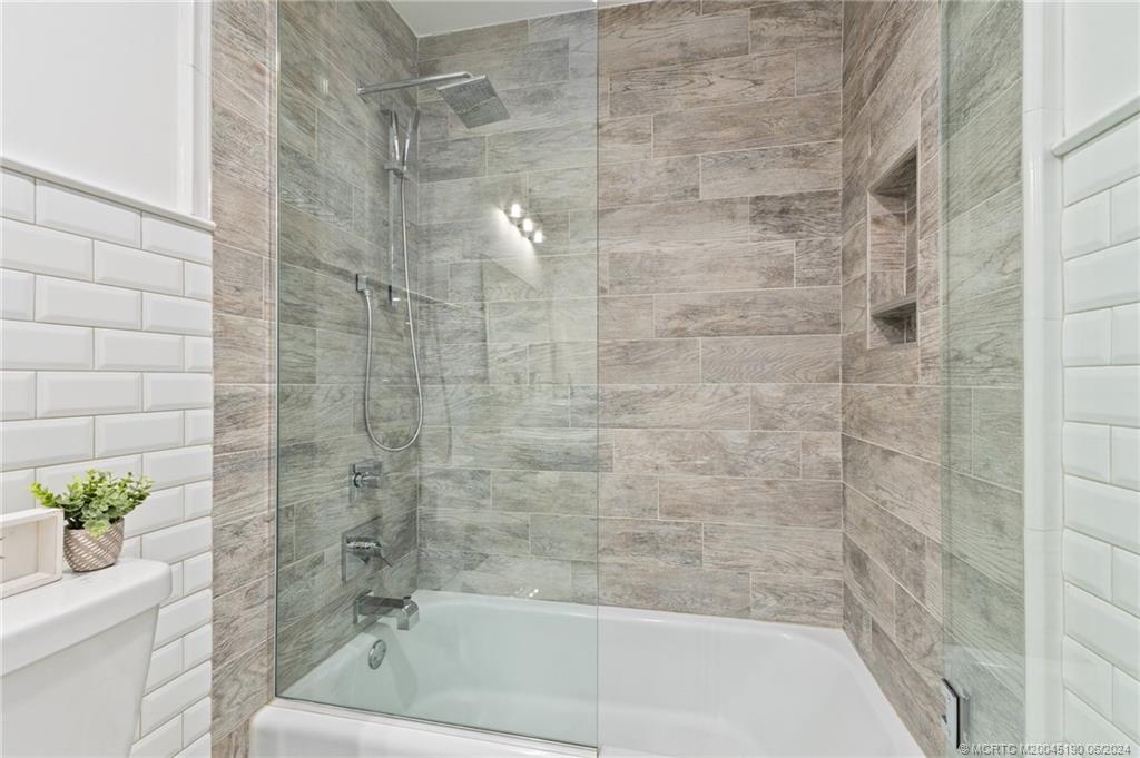 3 Mandalay Road Stuart, FL 34996 - Photo 40 of 65 a bathroom with a bathtub