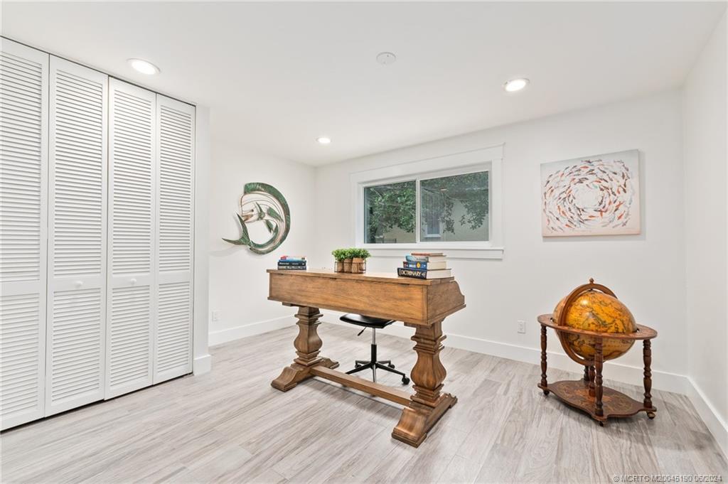 3 Mandalay Road Stuart, FL 34996 - Photo 41 of 65 a living room with furniture a rug and a window