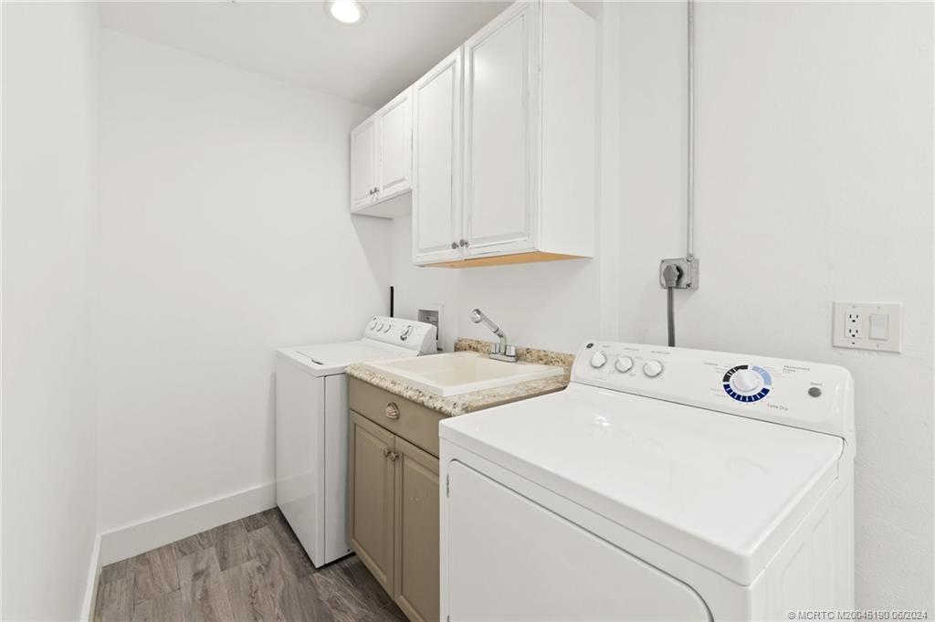 3 Mandalay Road Stuart, FL 34996 - Photo 43 of 65 a utility room with dryer and washer