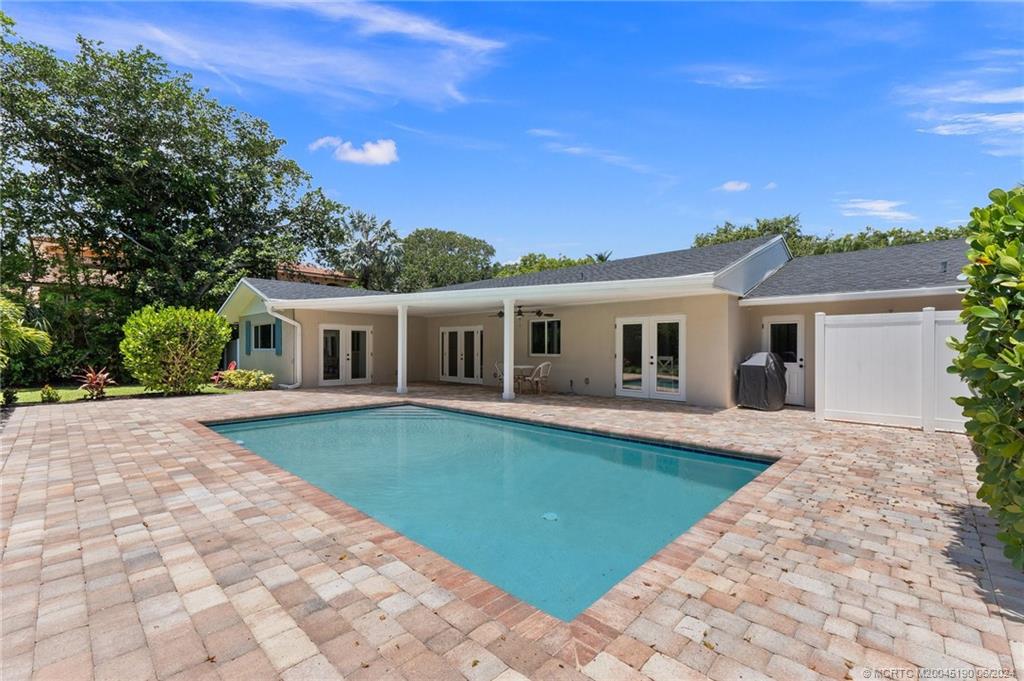 3 Mandalay Road Stuart, FL 34996 - Photo 45 of 65 a front view of a house with garden