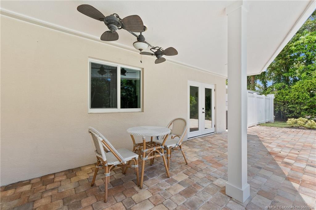 3 Mandalay Road Stuart, FL 34996 - Photo 49 of 65 a view of a dining room with furniture and chandelier