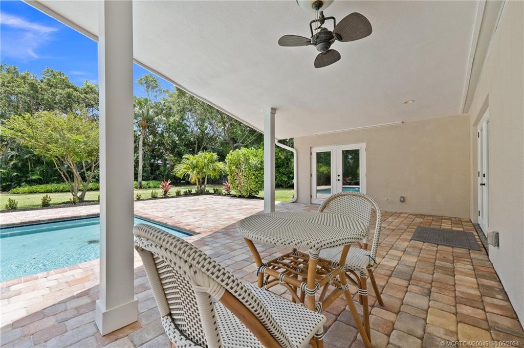 3 Mandalay Road Stuart, FL 34996 - Photo 50 of 65 a bed sitting in a room next to a large window