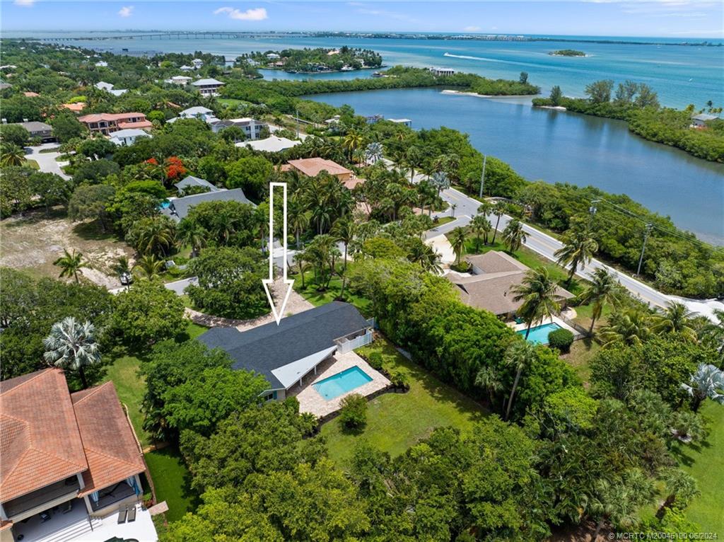 3 Mandalay Road Stuart, FL 34996 - Photo 58 of 65 an aerial view of residential houses with outdoor space and river