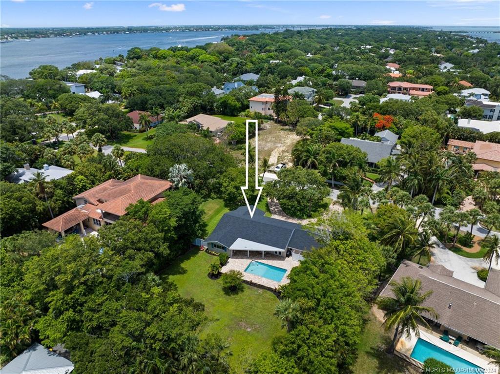 3 Mandalay Road Stuart, FL 34996 - Photo 60 of 65 an aerial view of a residential houses with outdoor space and trees all around