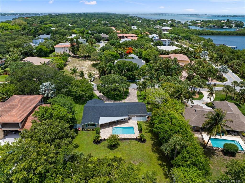 3 Mandalay Road Stuart, FL 34996 - Photo 62 of 65 an aerial view of house with yard swimming pool and outdoor seating