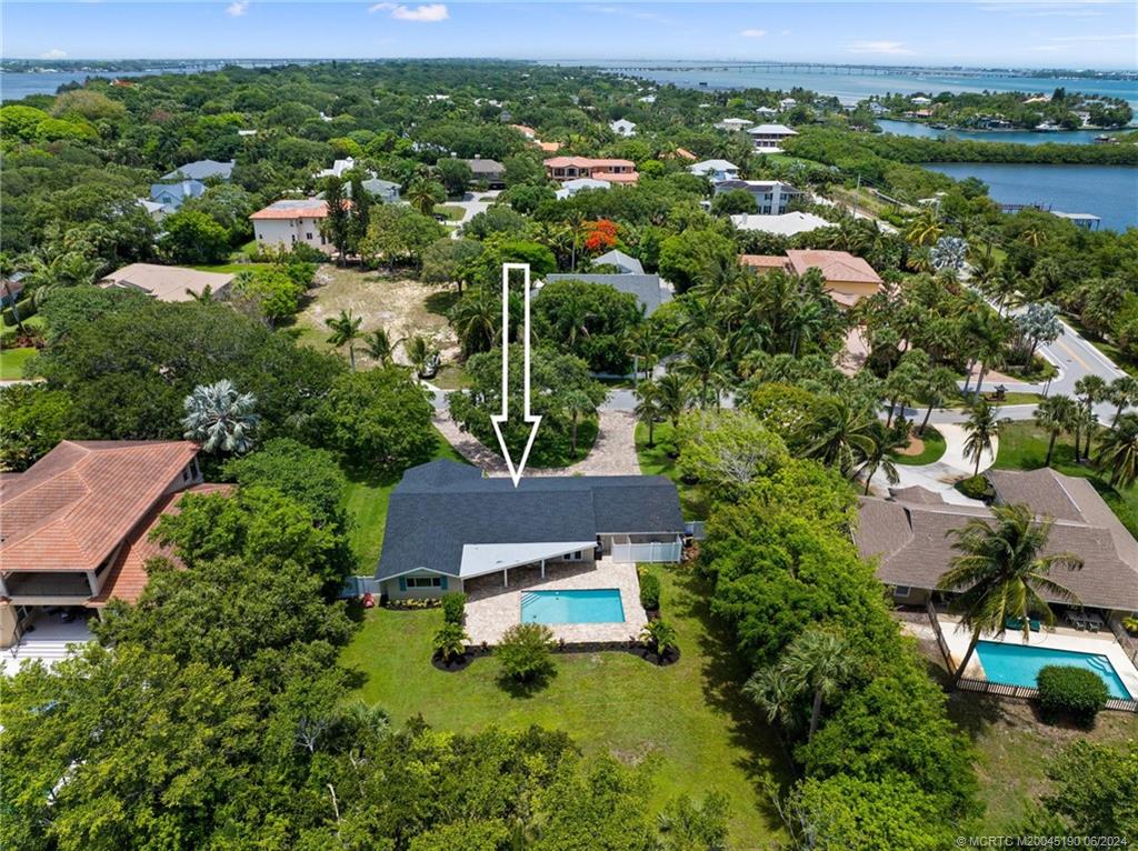 3 Mandalay Road Stuart, FL 34996 - Photo 63 of 65 an aerial view of residential houses with outdoor space and river