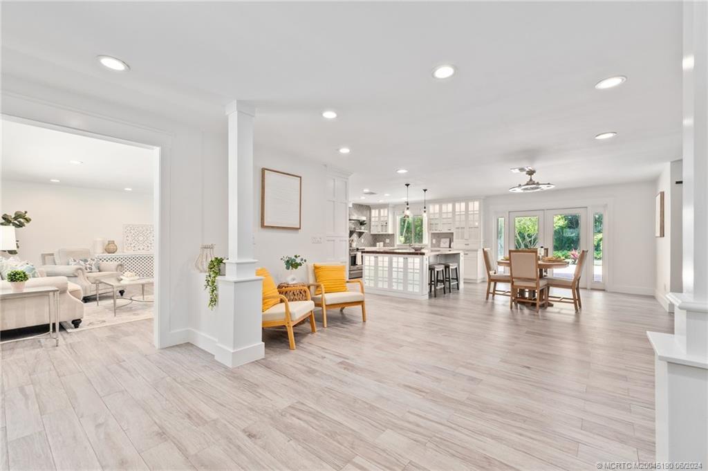 3 Mandalay Road Stuart, FL 34996 - Photo 8 of 65 a living room with furniture and a wooden floor