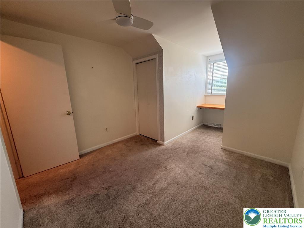 170 Springhouse Road Allentown, PA 18104 - Photo 14 of 23 A versatile space with angled walls, carpeted flooring, and a window niche perfect for a desk.