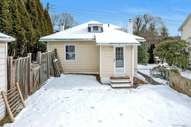 a view of a house with a white roof