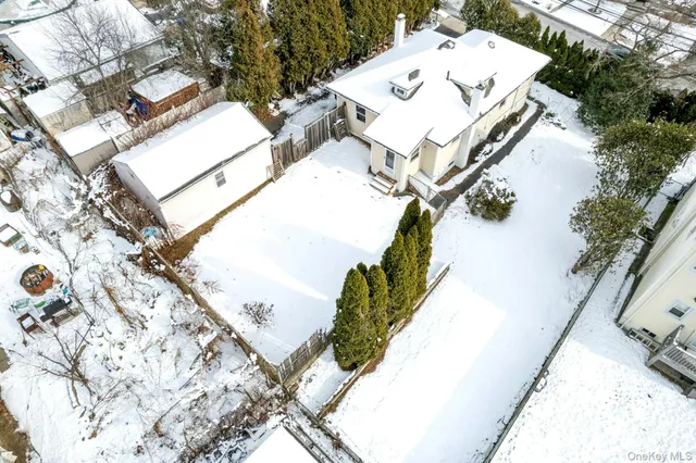 an aerial view of residential houses with city view