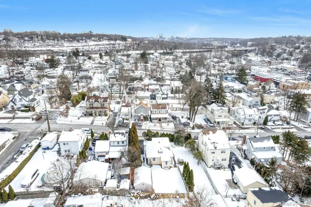 an aerial view of residential building with parking
