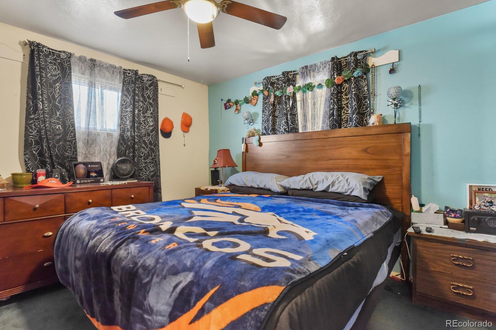 3400 West Mountain Road Englewood, CO 80110 - Photo 11 of 22 a bedroom with a large bed and a window