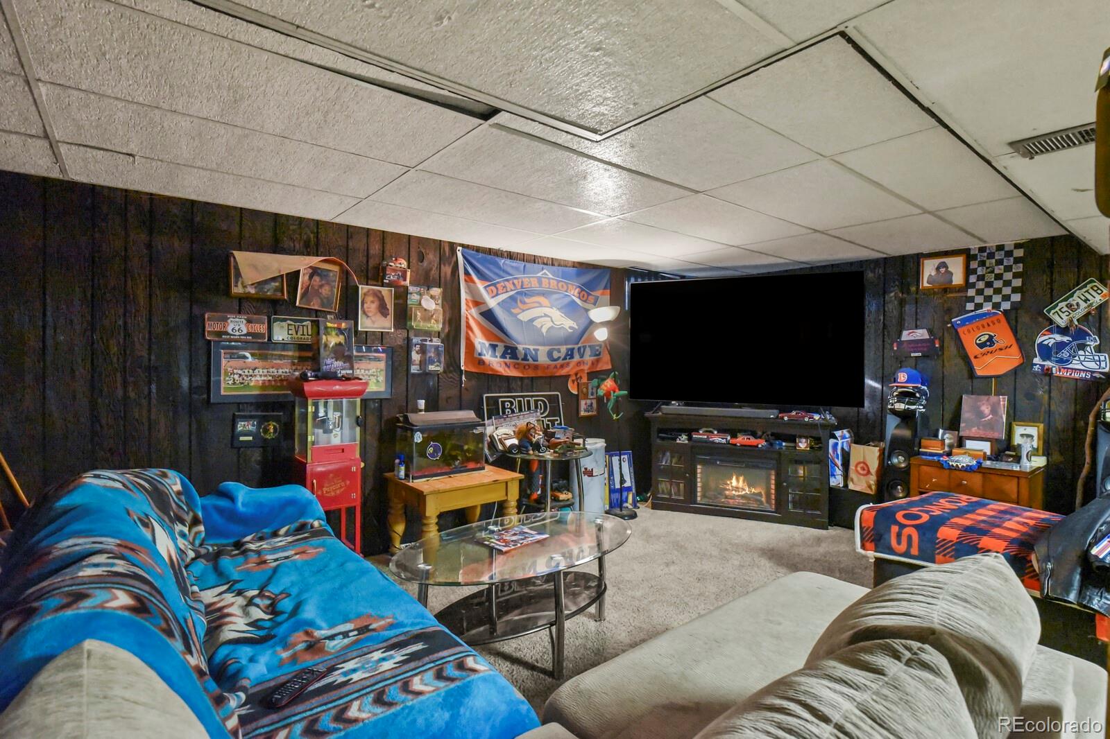 3400 West Mountain Road Englewood, CO 80110 - Photo 16 of 22 a living room with furniture and a flat screen tv