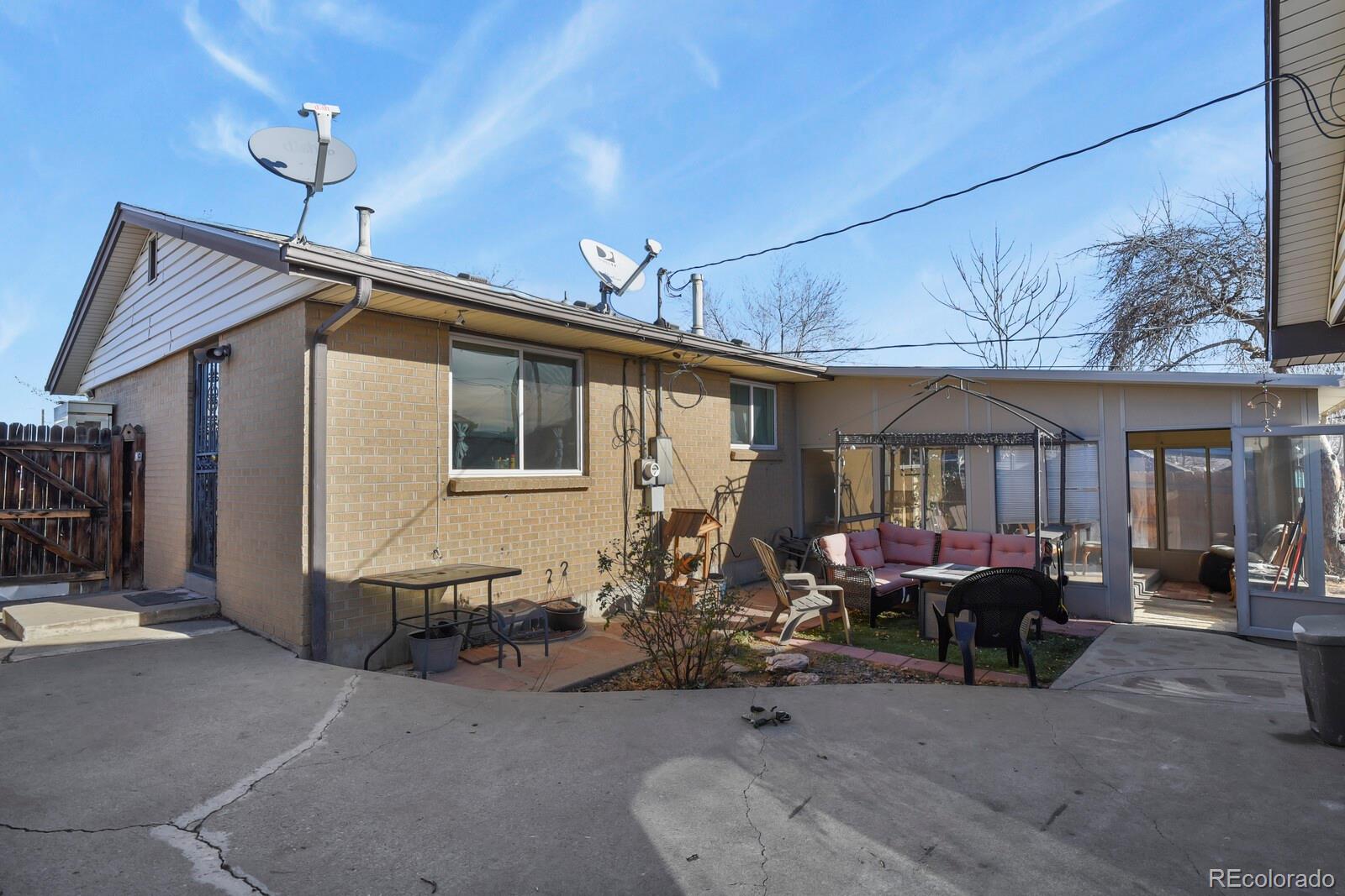 3400 West Mountain Road Englewood, CO 80110 - Photo 20 of 22 a front view of a house with outdoor seating