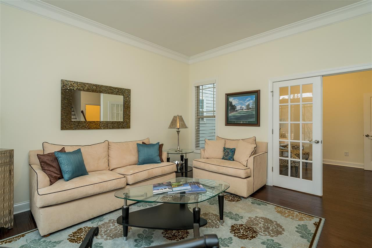 5616 Wade Park Boulevard Raleigh, NC 27607 - Photo 5 of 30 This bright and open living room connects to the office. Living Room