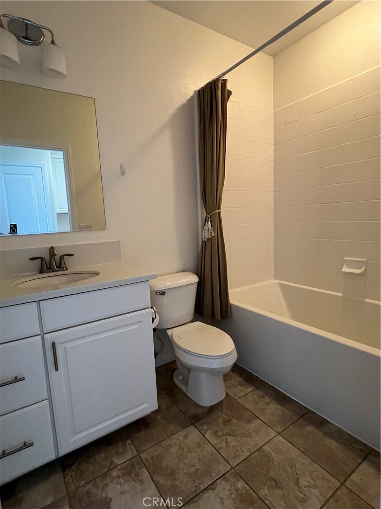 104 Rose Arch Irvine, CA 92620 - Photo 11 of 12 a bathroom with a toilet sink and mirror