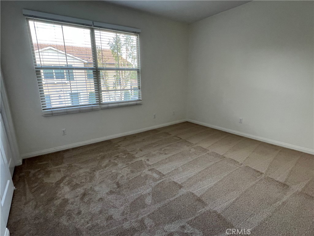 104 Rose Arch Irvine, CA 92620 - Photo 12 of 12 an empty room with a window