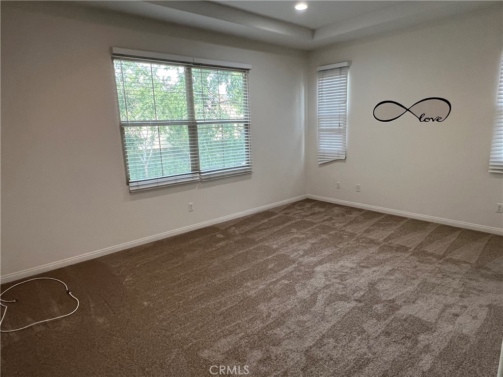 104 Rose Arch Irvine, CA 92620 - Photo 6 of 12 an empty room with windows