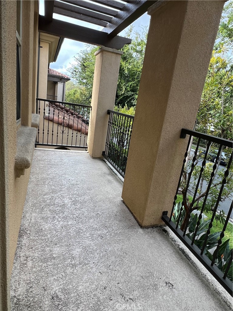 104 Rose Arch Irvine, CA 92620 - Photo 9 of 12 a view of a porch with wooden floor