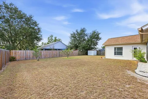 an empty room with windows and garden