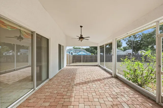 a view of a room with wooden floor and a porch