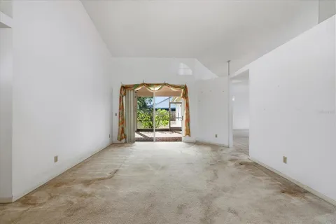 a kitchen with cabinets appliances a sink and a counter top