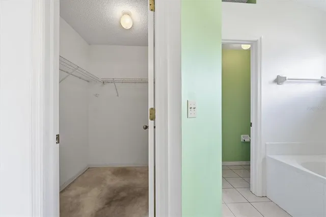 a view of a bathroom with a bathtub and shower