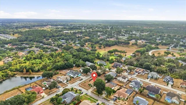 an aerial view of residential houses with city view