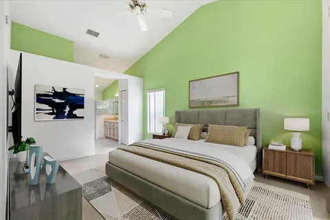 a bedroom with a bed and a couch