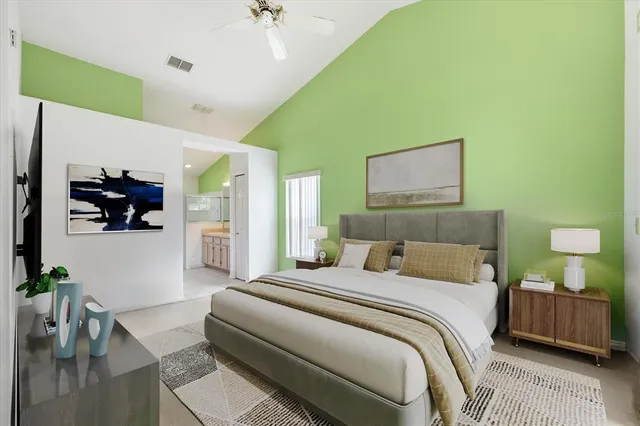 a bedroom with a bed and a couch