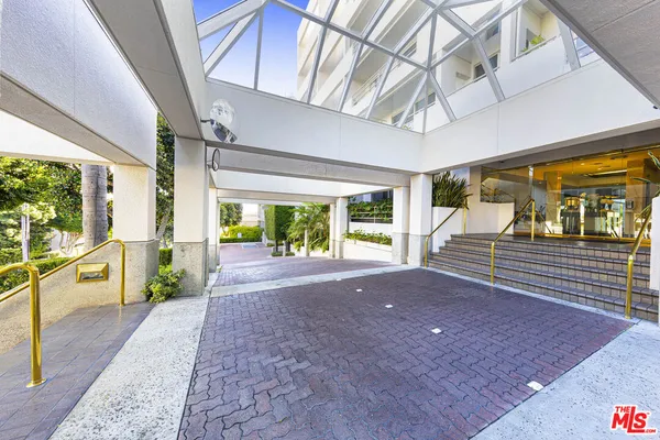 a living room with white walls and furniture