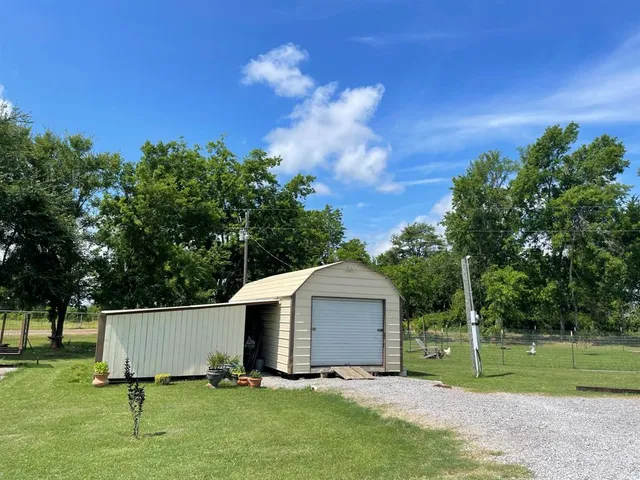 a view of an house with backyard space and garden