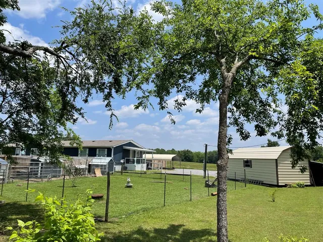 an aerial view of a house with swimming pool