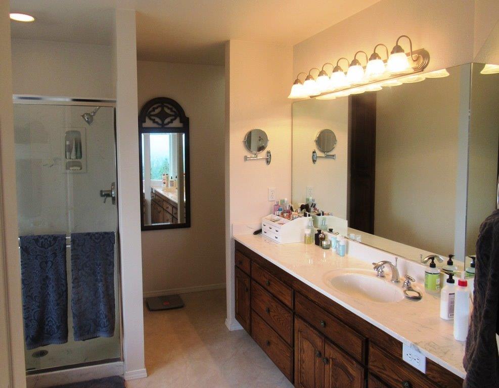 1961 Crow Road Merlin, OR 97532 - Photo 19 of 35 a bathroom with a double vanity sink and a mirror
