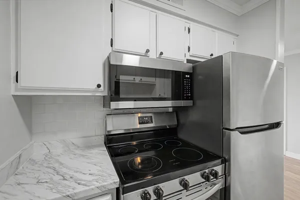 a kitchen with a stove and a microwave